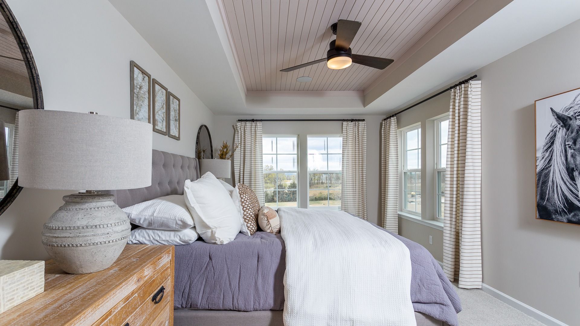 A generously-sized owner's suite with a tray ceiling and plenty of light in the Darlington II.