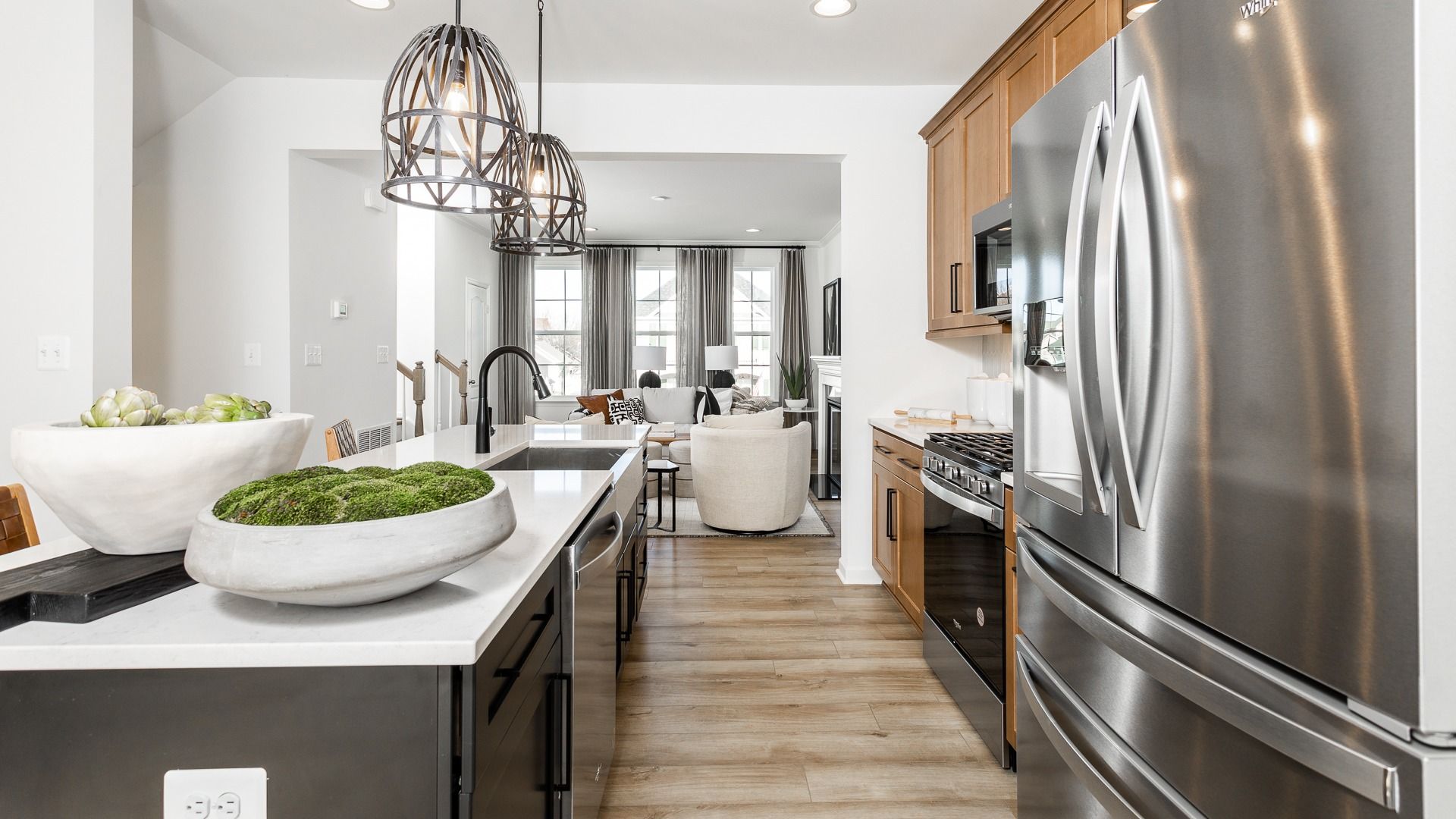 Modern open-concept kitchen with large island in the Bedford II floor plan.