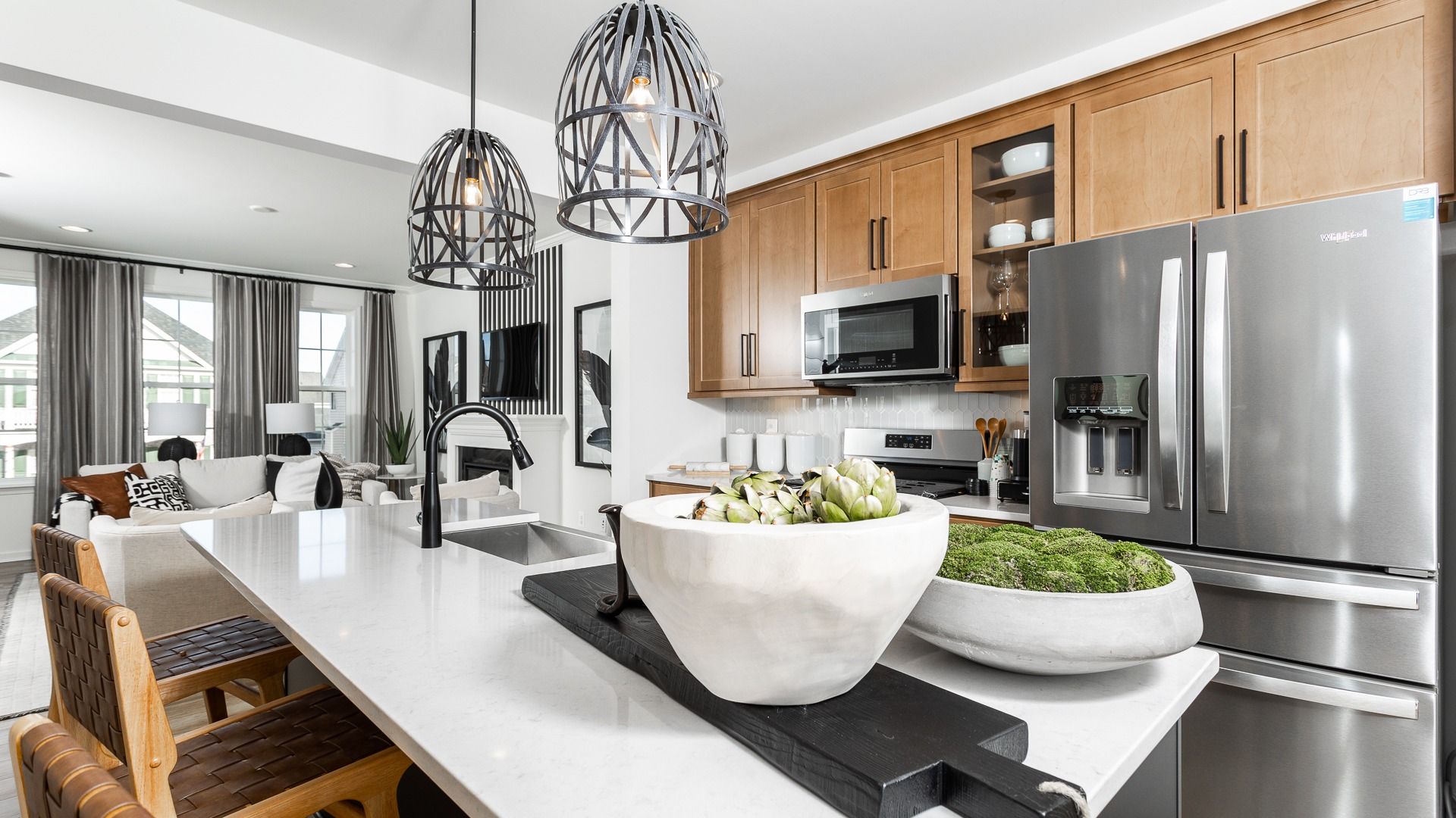The modern kitchen in the Bedford II floor plan features a center island and prep sink.