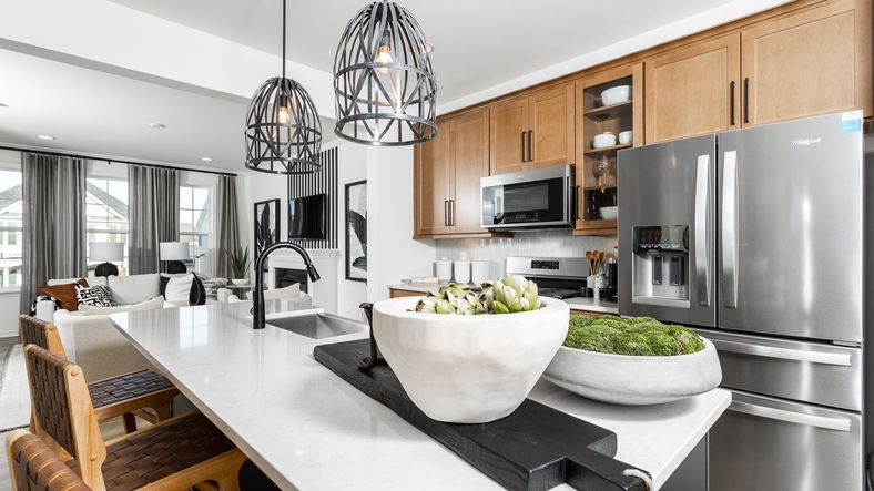 The modern kitchen in the Bedford II floor plan features a center island and prep sink.