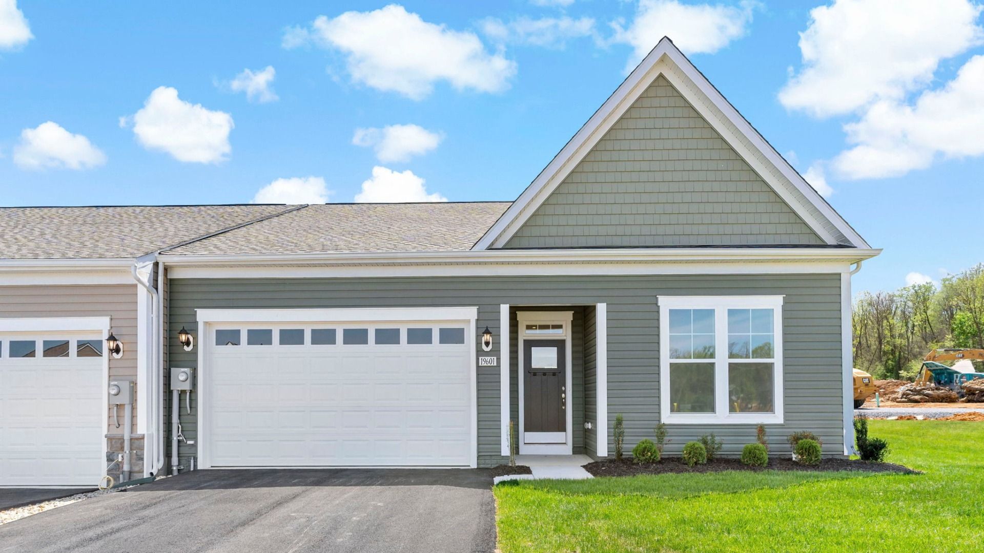 Front view of the Finch II one-level home, highlighting its clean lines and inviting entrance.