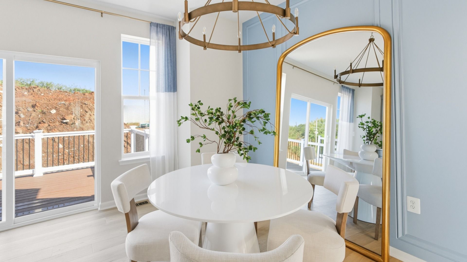 The kitchen and dining area of the Bedford II blends natural elements with functional living.