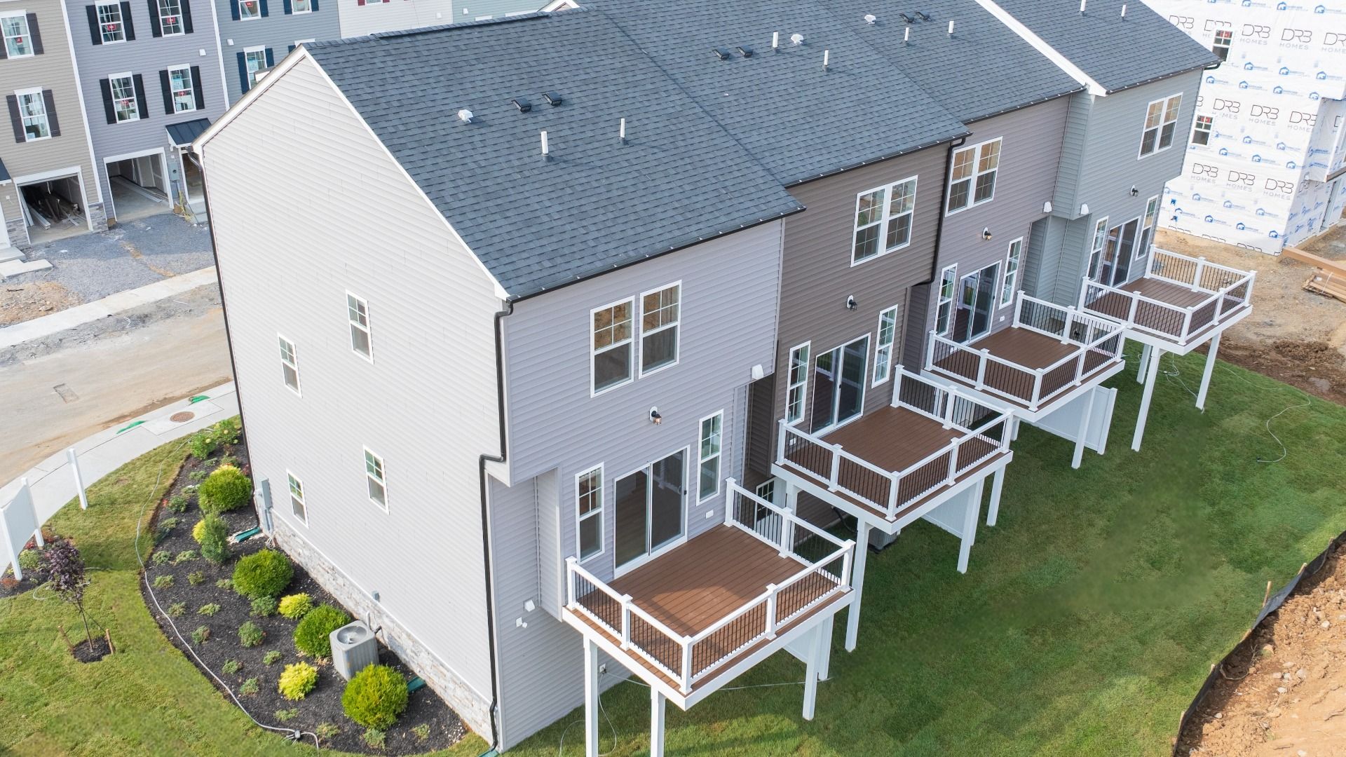 Rear elevation of the Bedford II featuring the included deck for outdoor enjoyment.