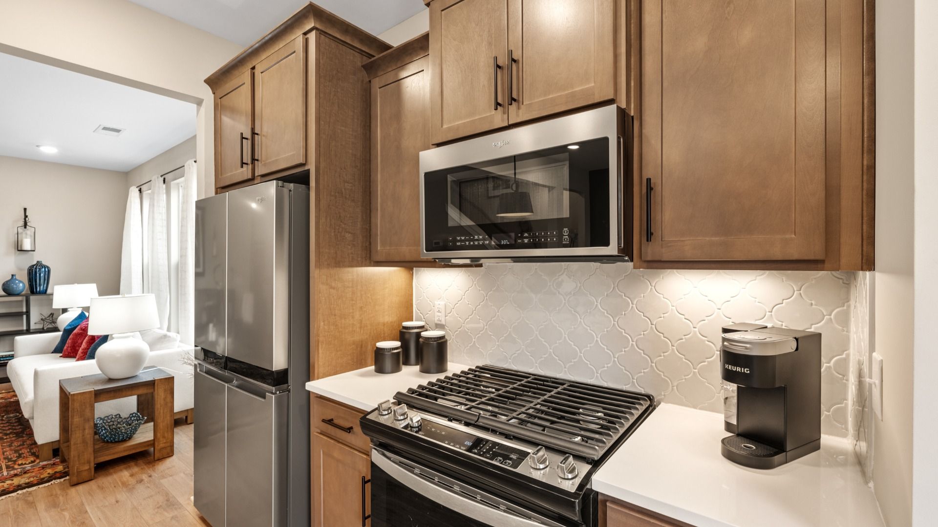 Memorable meals begin in this vibrant kitchen with stainless appliances and quartz countertops at Brookland Place