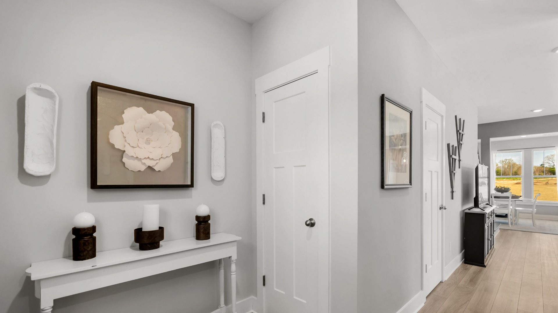 Memorable arrival experience with hardwood floors and elegant trim in the foyer located in Hendersonville, NC