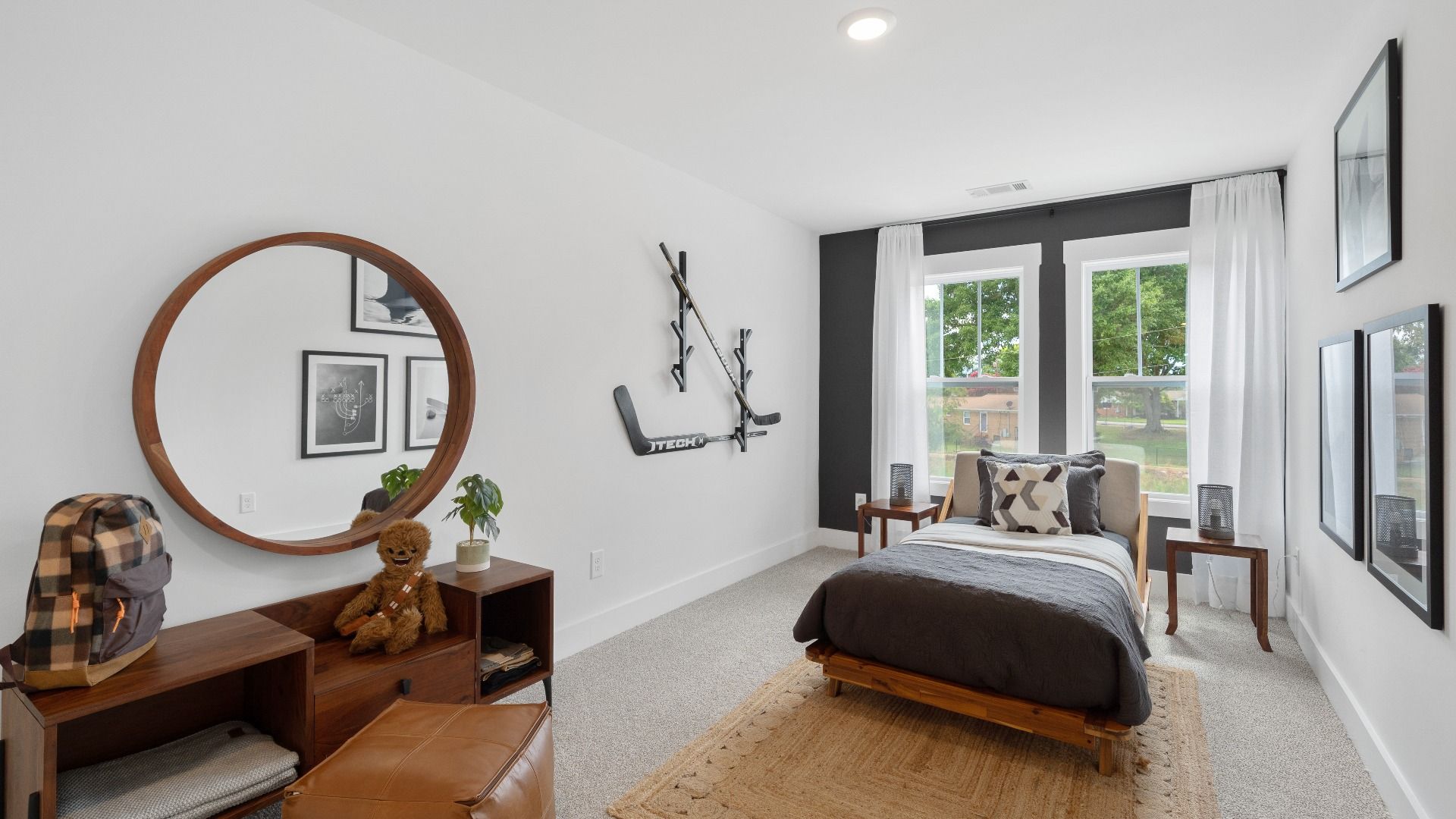 Memorable space with walk-in closet, soft carpeting, and striking natural light from large windows at Brookland Place