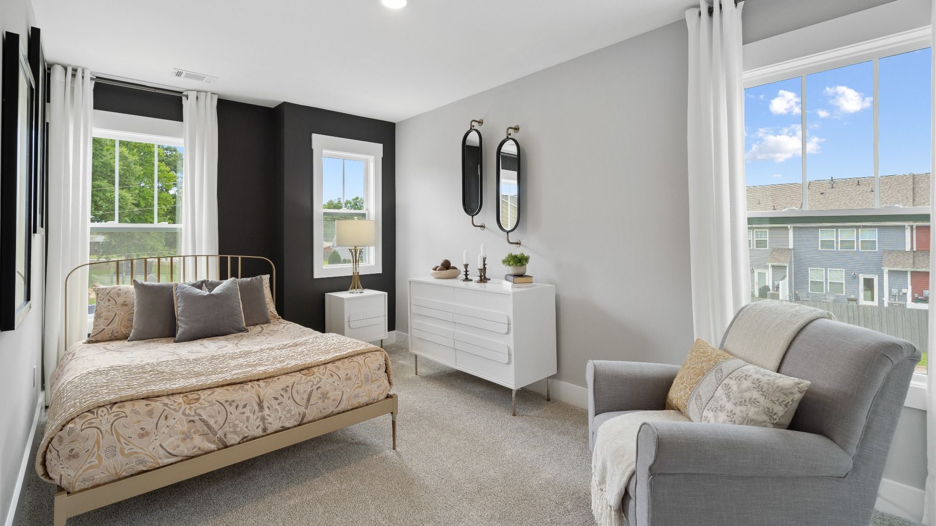 Refined bedroom design with large windows for daylight-filled mornings and peaceful views in Hendersonville, NC