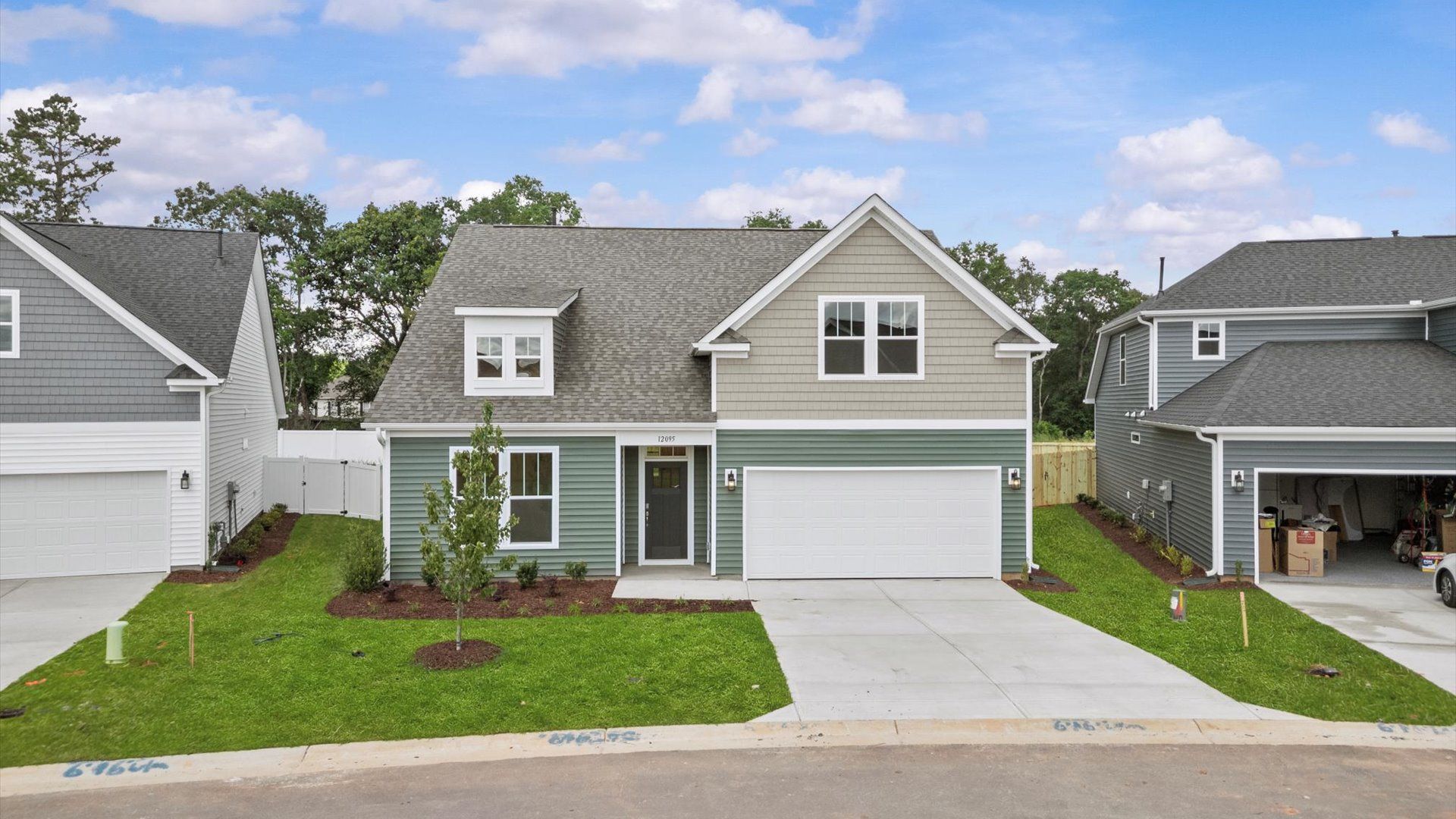 DRB Homes' Walnut Ridge community featuring the Cooper 3 in a stunning bright white exterior with stone detailed columns