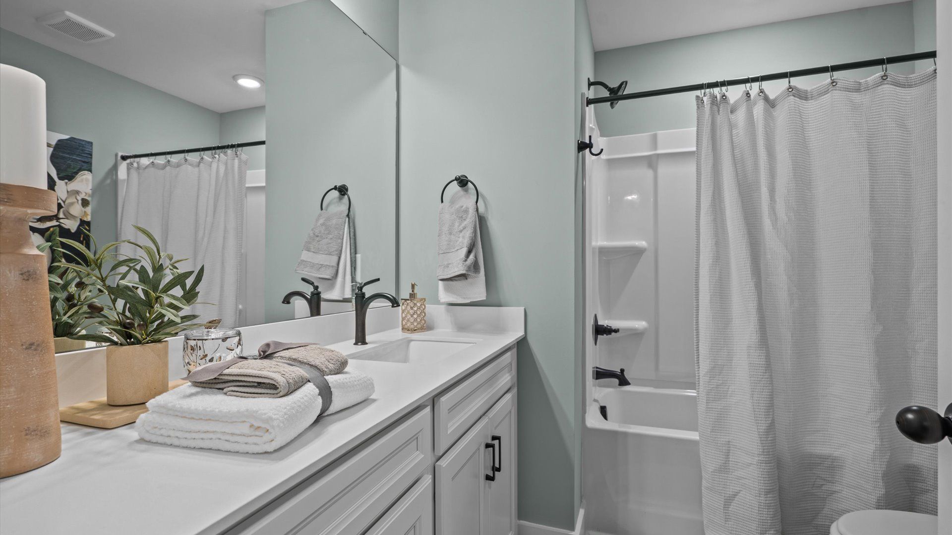 Vibrant and welcoming bathroom with elegant countertop space and polished details in Simpsonville, SC