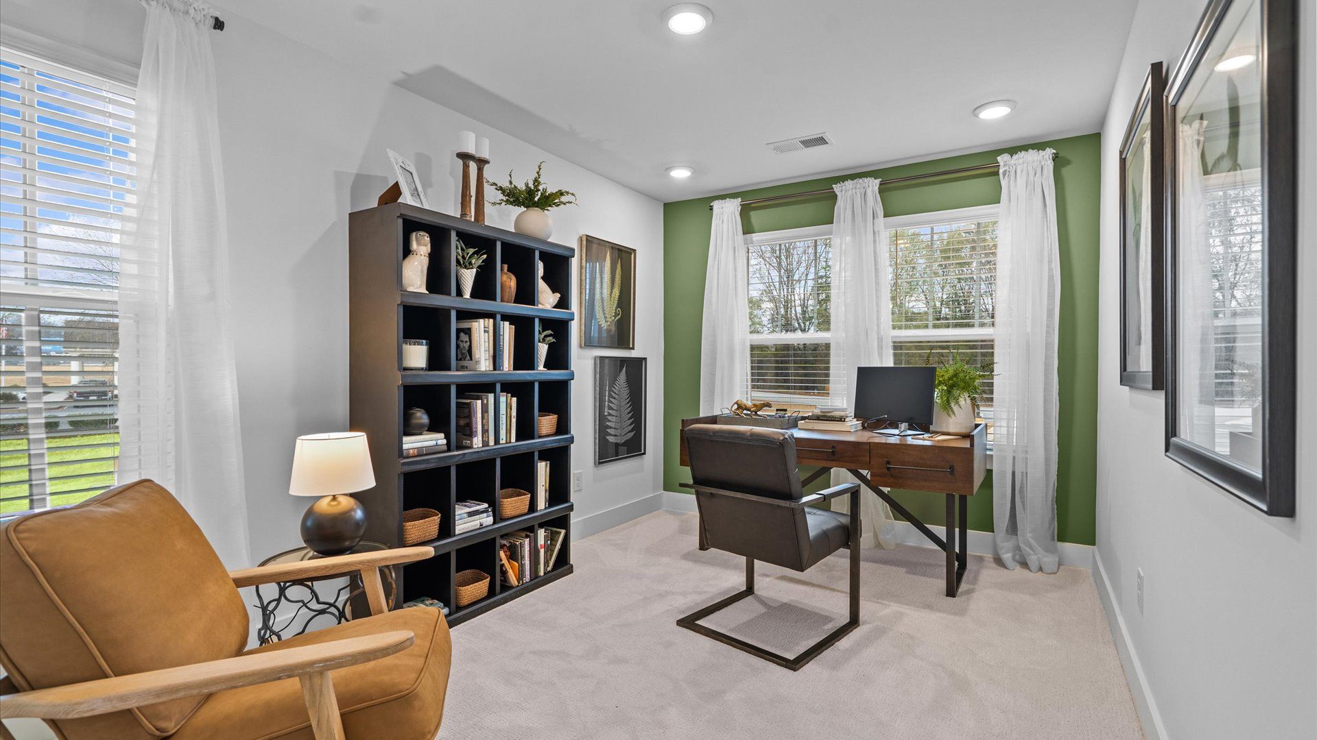 Tasteful study offering a quiet, elegant workspace in this vibrant Simpsonville townhome at Gresham Station