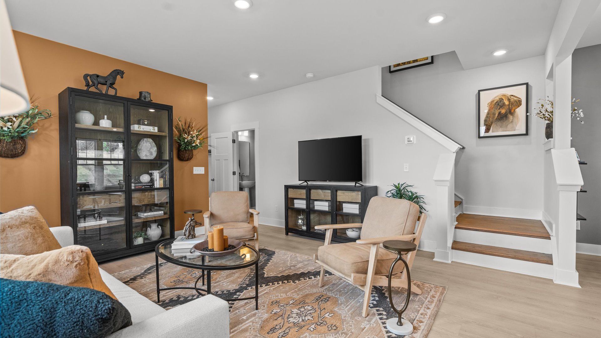 Memorable moments begin in this elegant, open family room with hardwood flooring and refined finishes at El Dorado