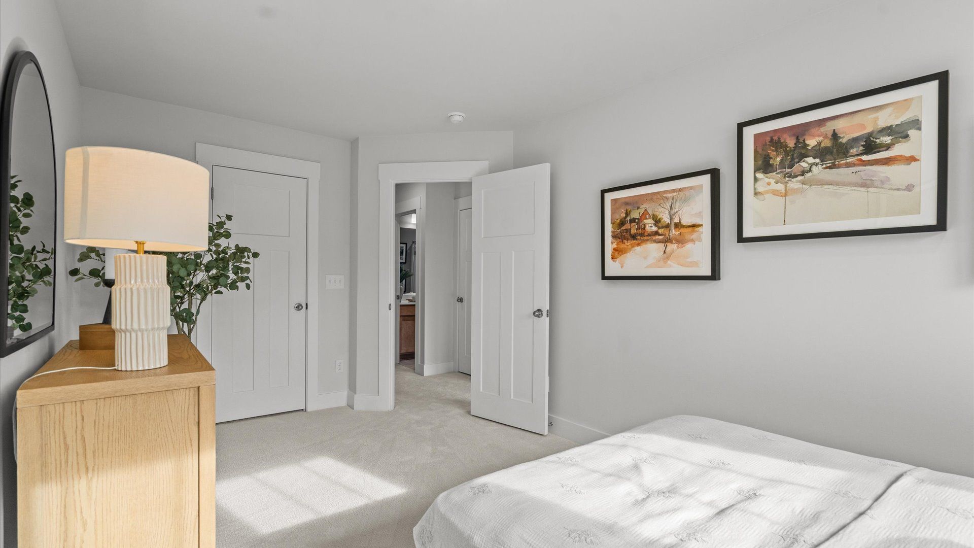 Tasteful bedroom with plush carpet, a walk-in closet, and a large window for abundant natural light in Spartanburg, SC