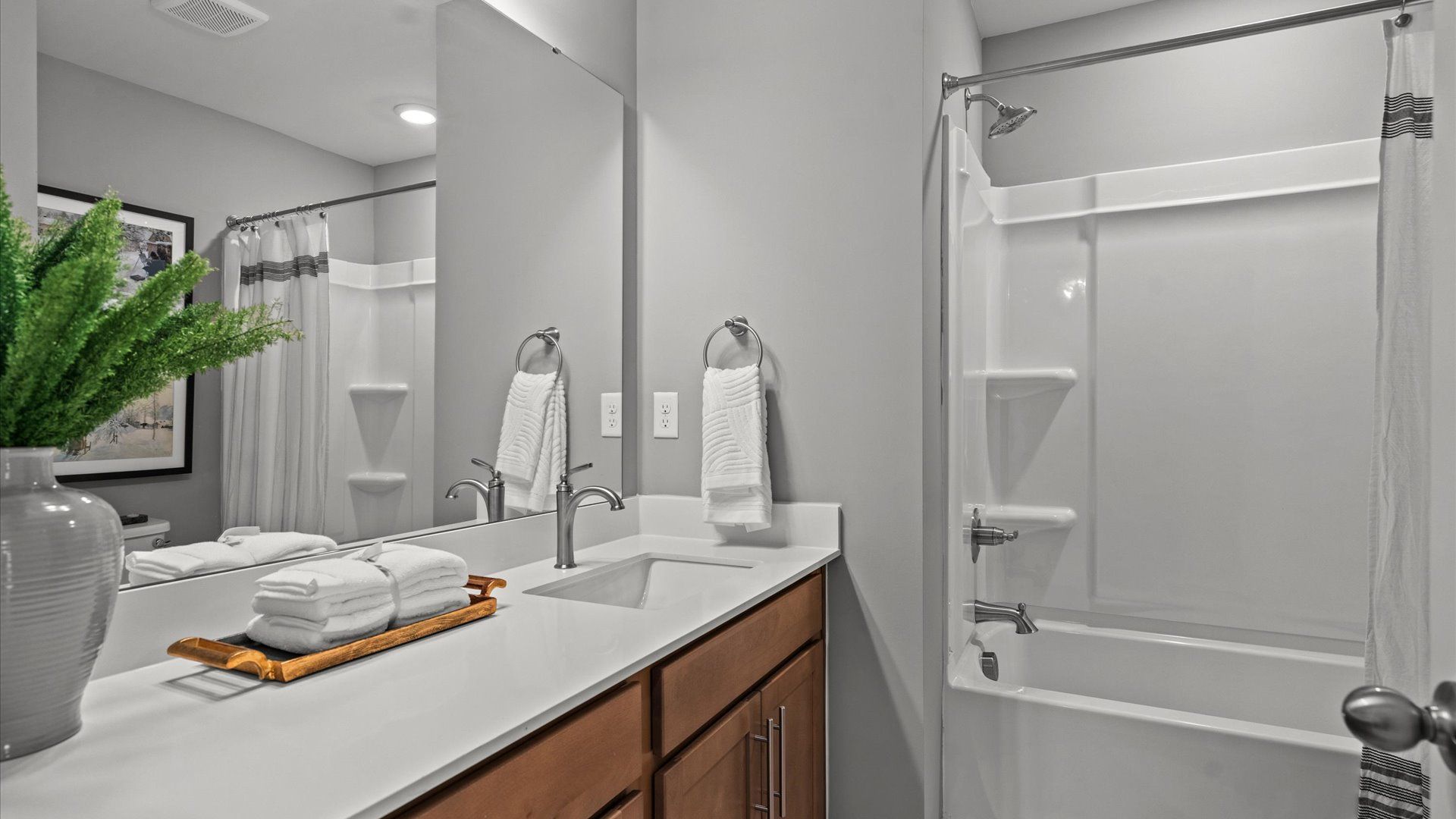 Notable full bathroom offering tasteful details and a bright, functional space in this townhome at El Dorado