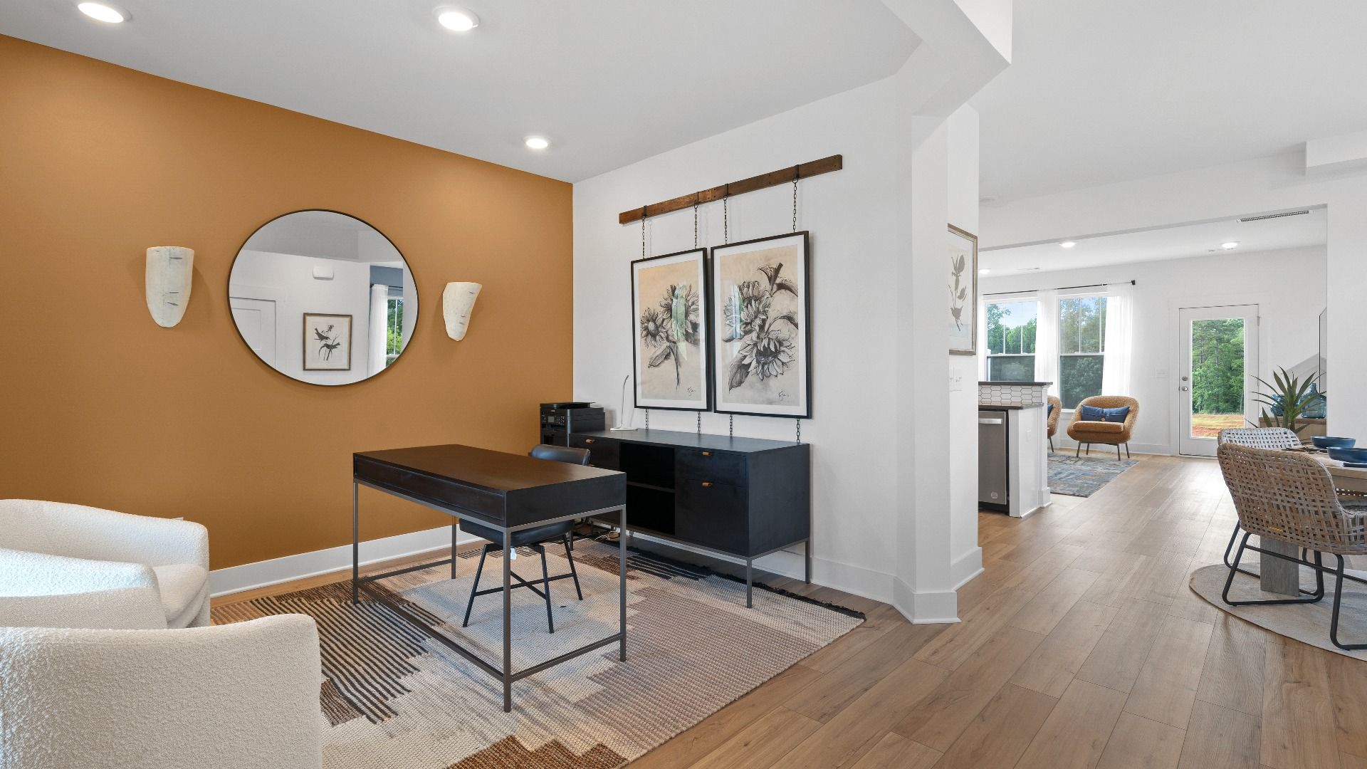Memorable workspace with modern finishes and exceptional light and flow at this villa at the Clarke Townes community