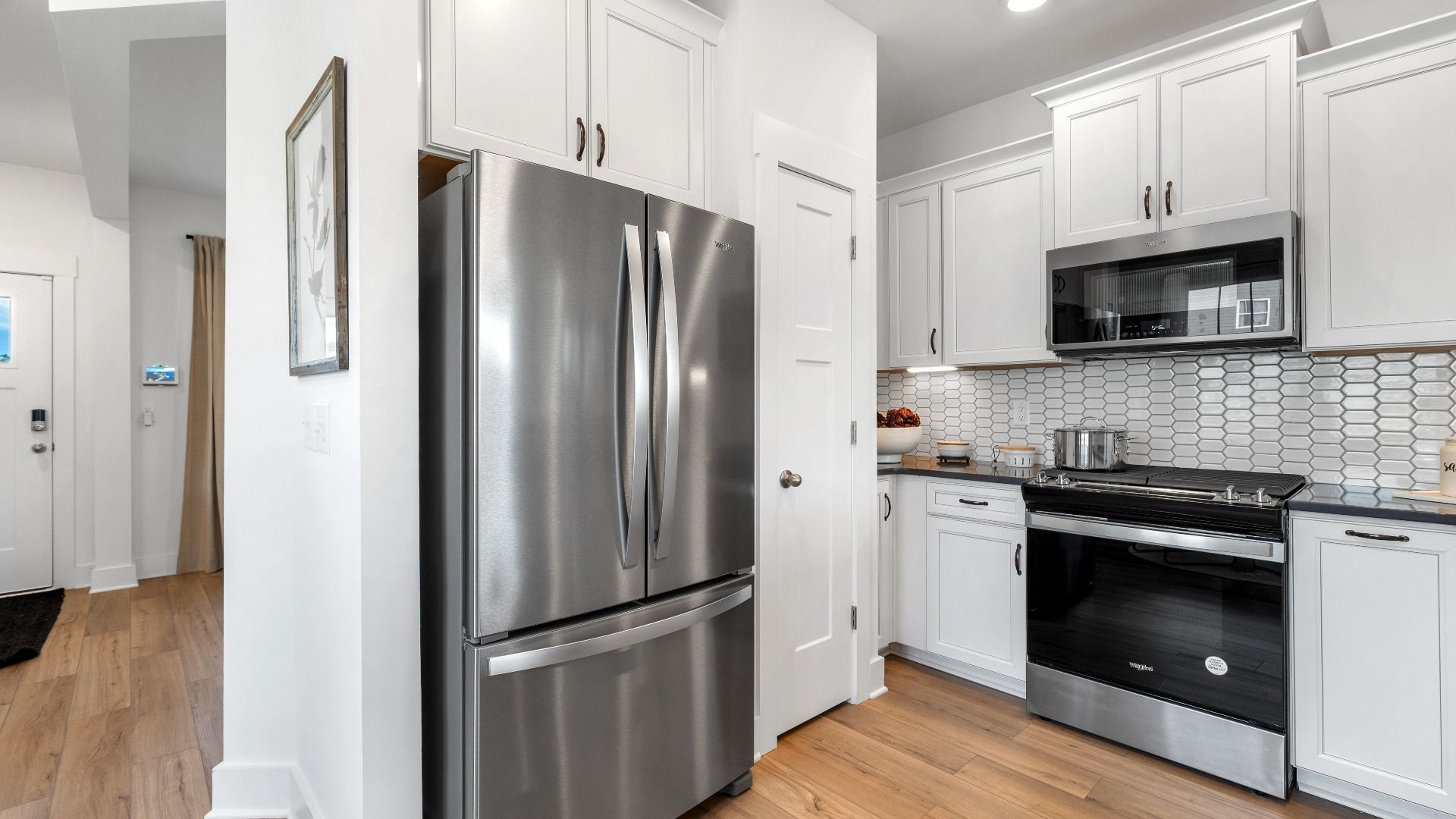 Well-designed kitchen with superior cabinetry and tasteful finishes that elevate everyday living at Clarke Townes community