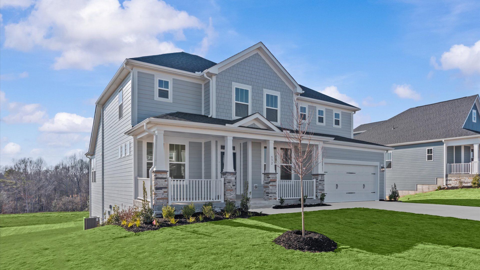 Exclusive DRB Homes exterior with balanced proportions and vibrant curb appeal