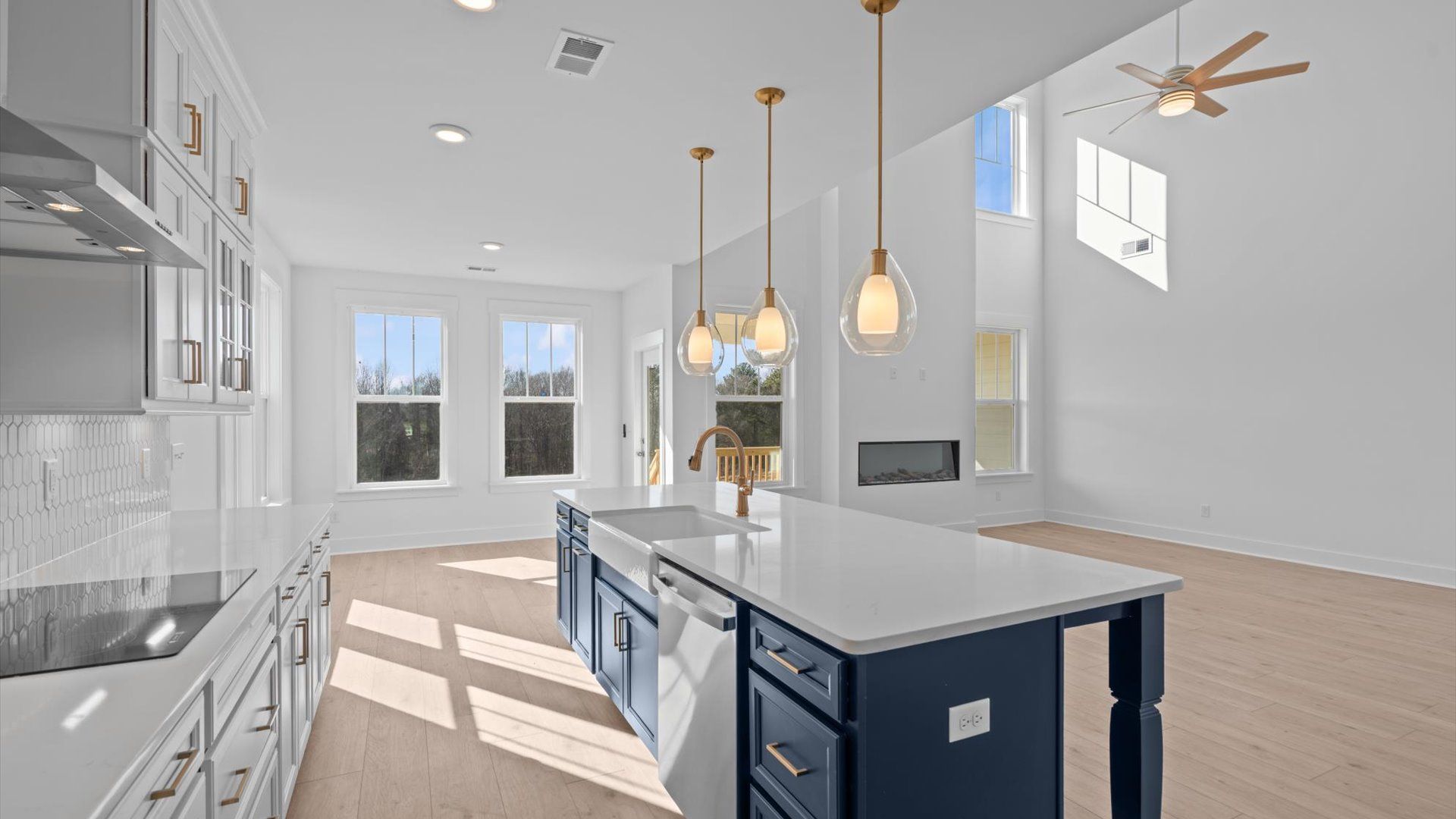 Memorable meals begin in this vibrant kitchen with pendant lighting and a thoughtfully designed island