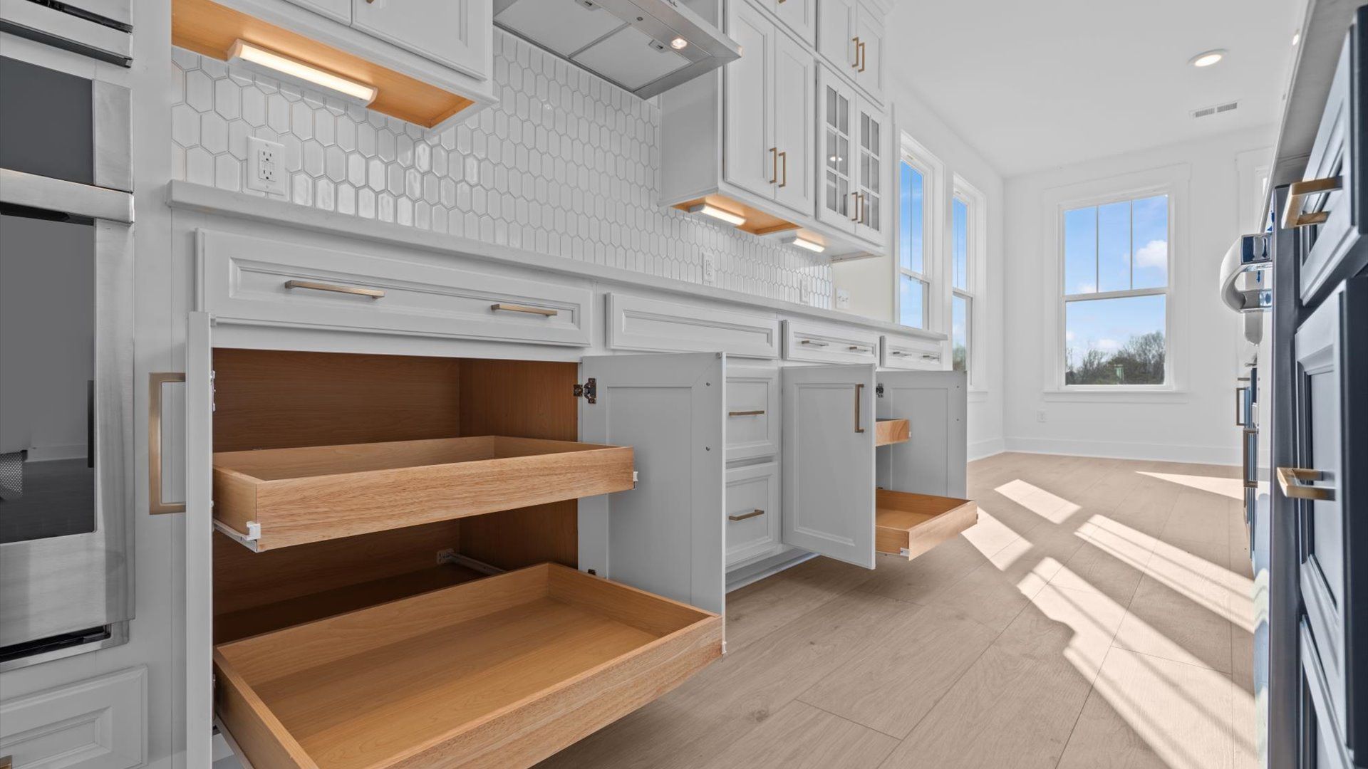 Exceptional culinary space with a striking 9-foot island and eye-catching pendant lights