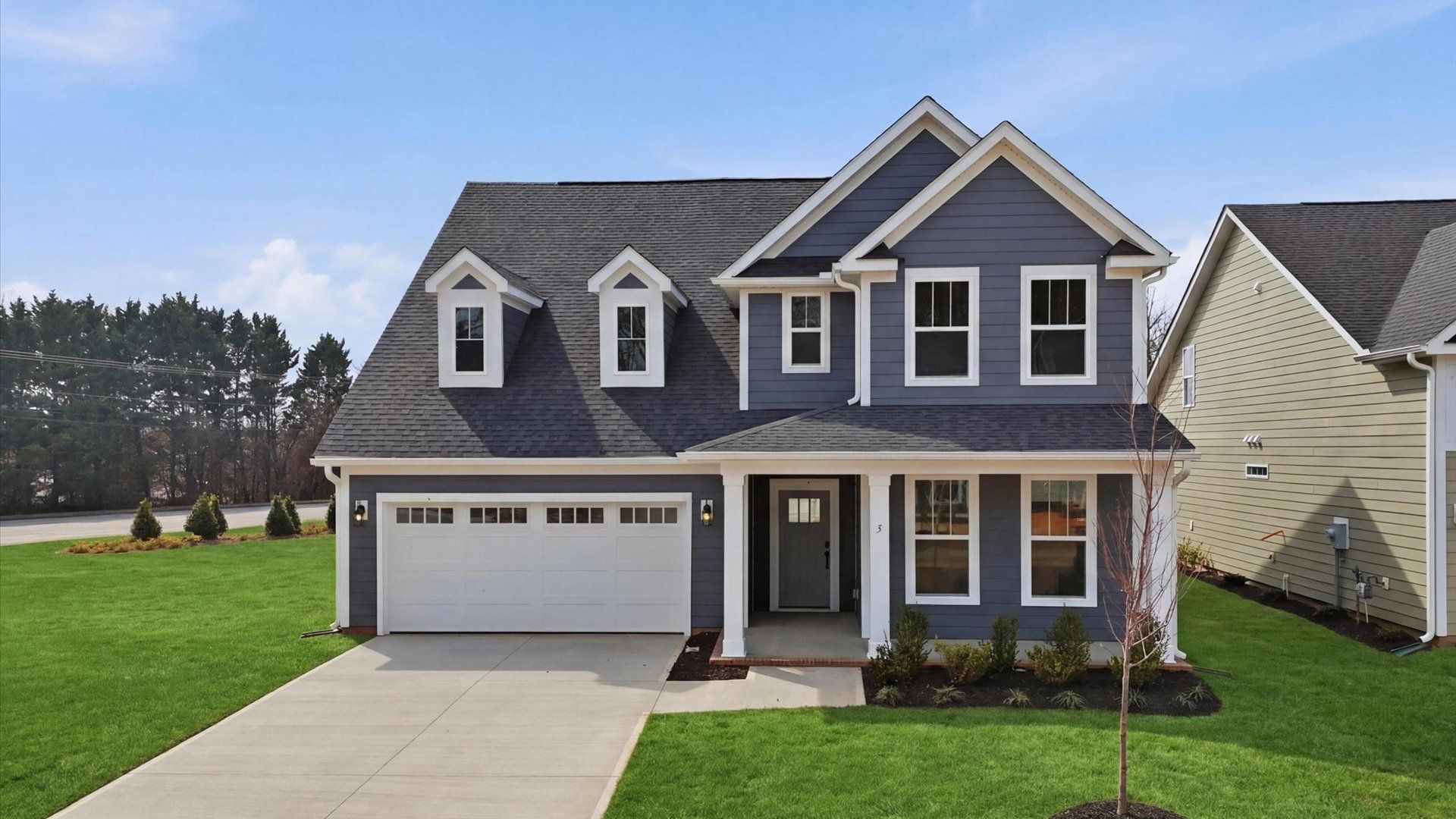 Elegant exterior with eye-catching curb appeal in a first-class DRB Homes Pelham Crossing community