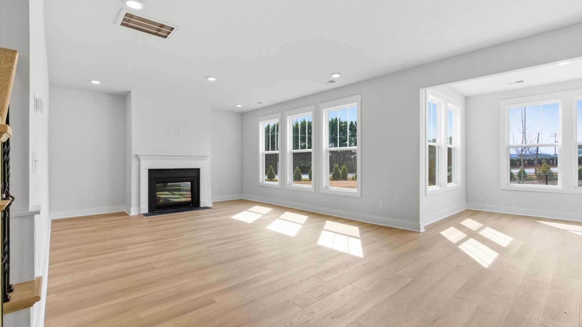Exceptional family room with hardwood flooring in this exclusive Greenville-area single family home