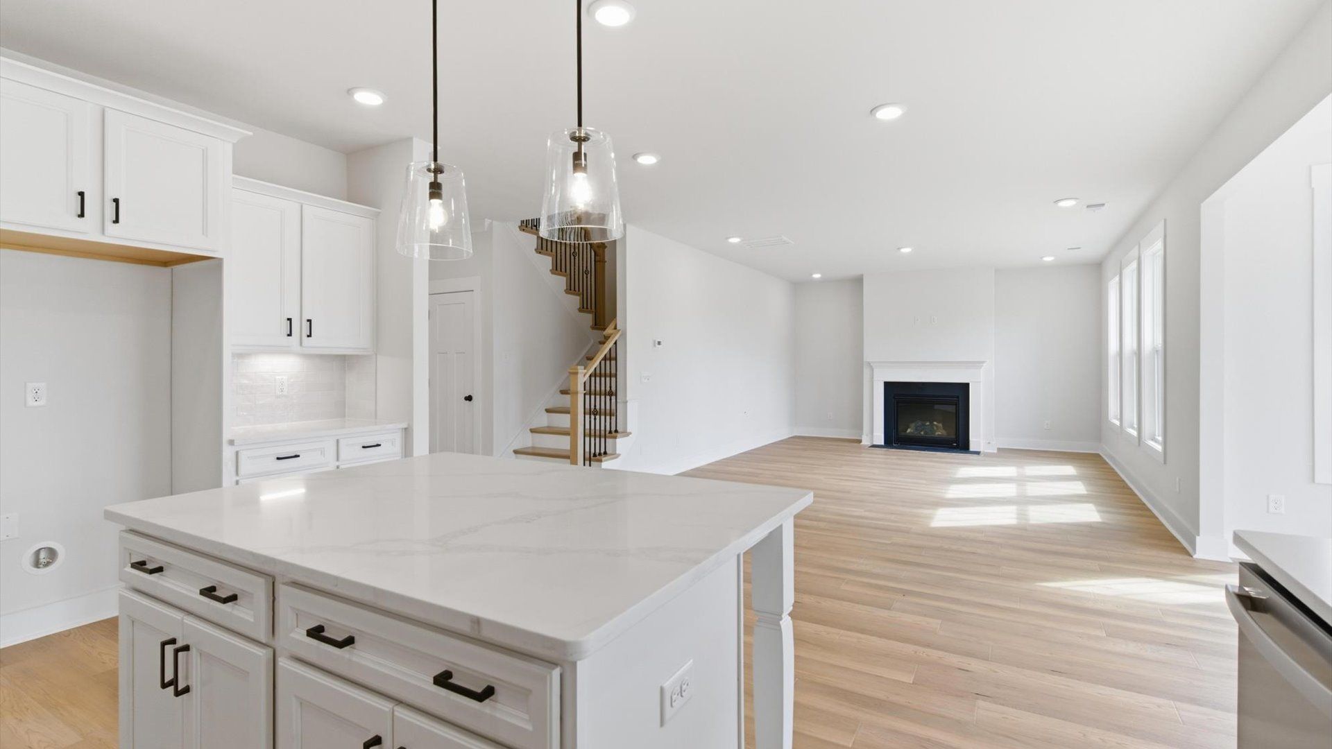 Exclusive kitchen design with a center island, pendant lights, and tasteful finishes throughout at Pelham Crossing