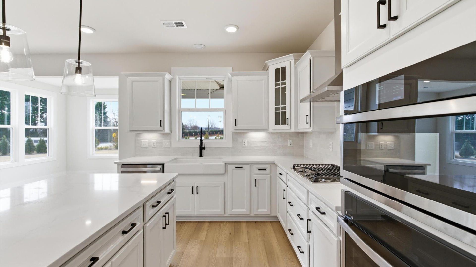 Tasteful kitchen with a streamlined island and modern finishes in a first-class DRB Homes design in Greenville, SC