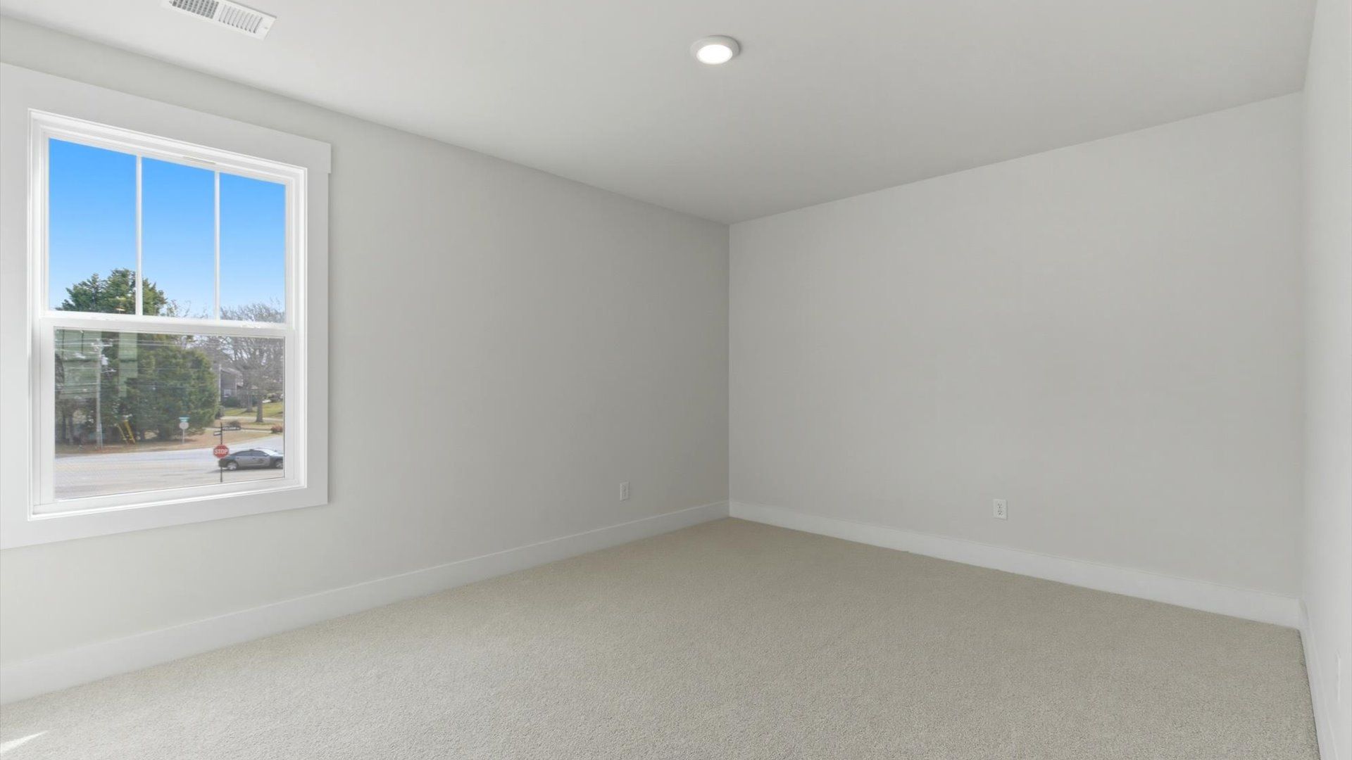 Vibrant and restful bedroom with oversized windows, refined detail, and a warm, welcoming atmosphere in Greenville, SC