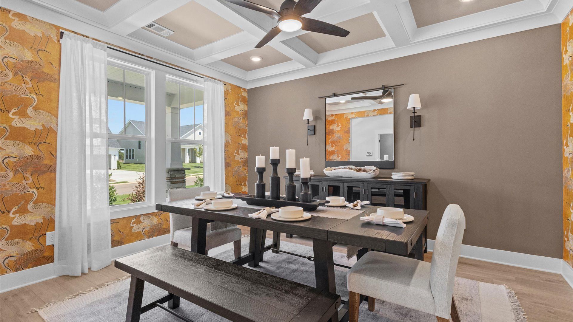 Modern layout with classic touches like a coffered ceiling in this select home