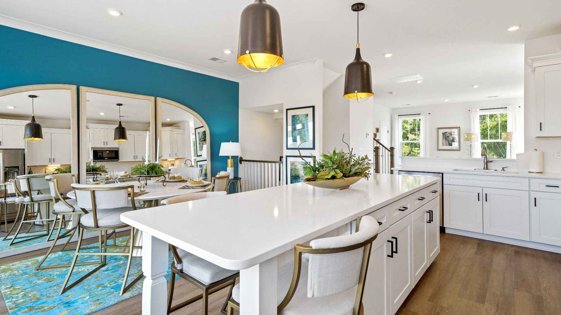 Highly skilled craftsmanship shines in this modern kitchen with pendant lighting and a central island focal point