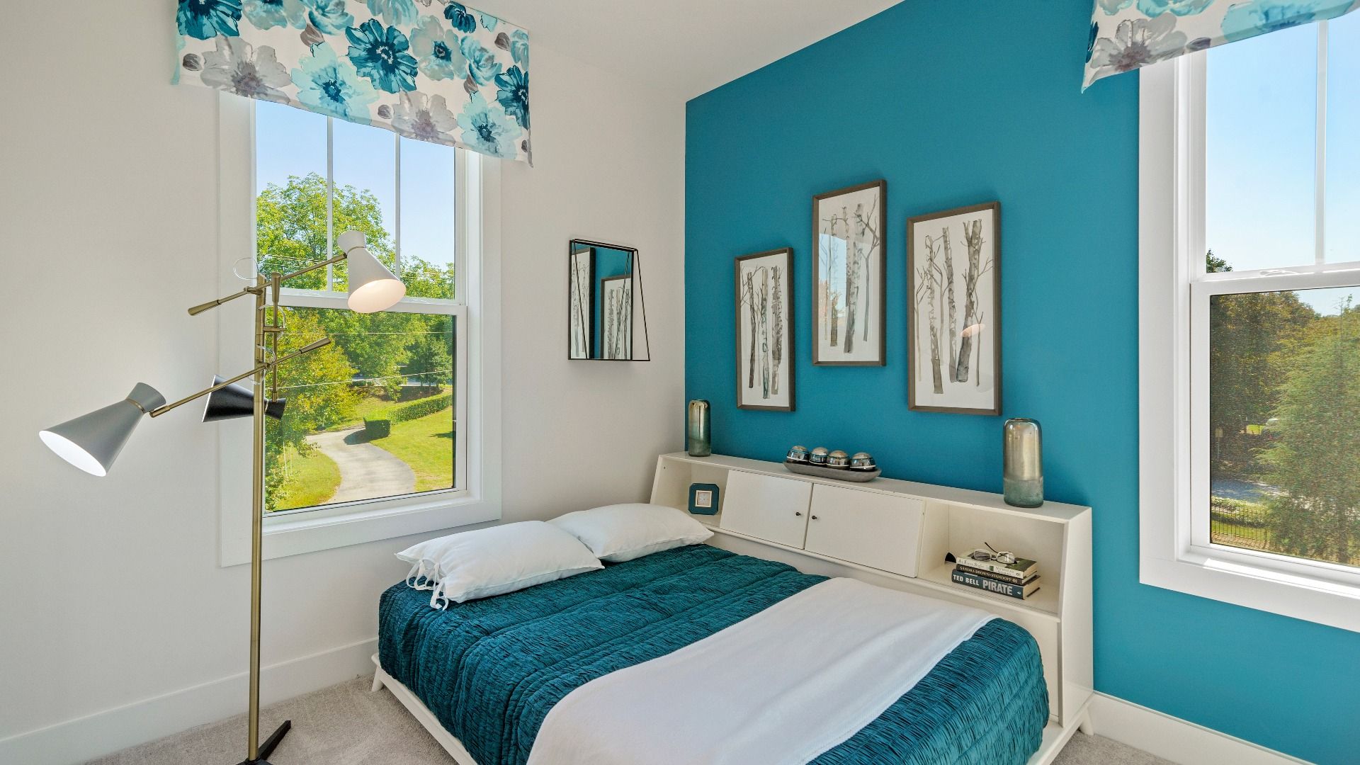 Tasteful bedroom with plush carpet, a walk-in closet, and large windows for abundant natural light near Downtown Greenville