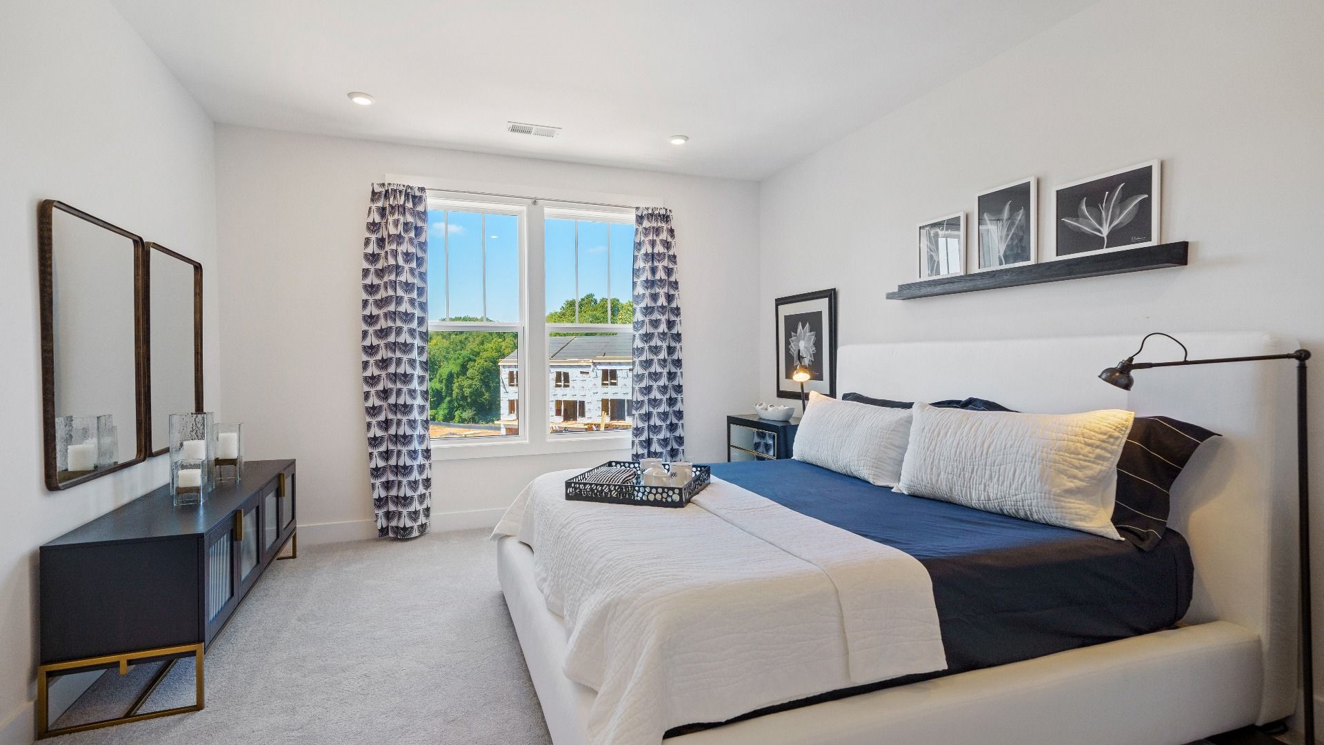 Eye-catching details and elegant finishes in the primary suite of this select villa at the new Montgomery Chase community