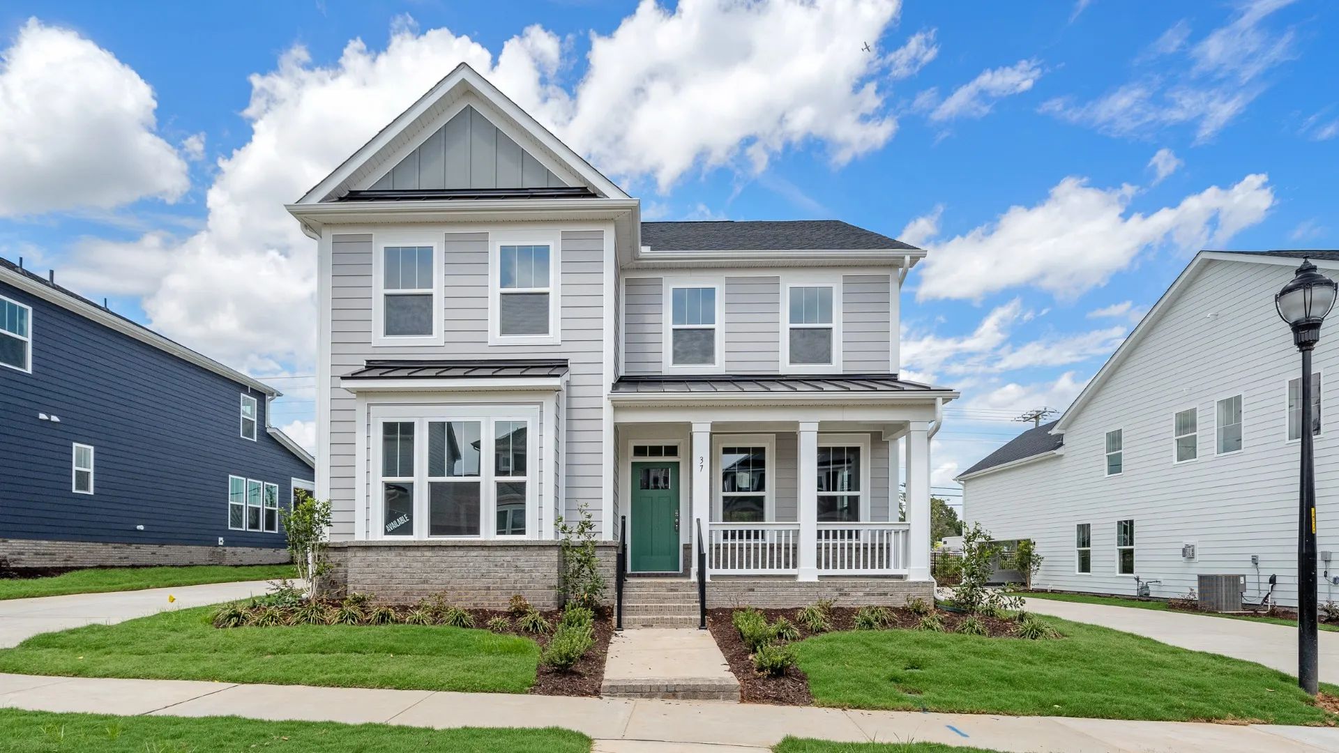 Elegant exterior of the Grayson design with eye-catching curb appeal in a new first-class DRB Homes community