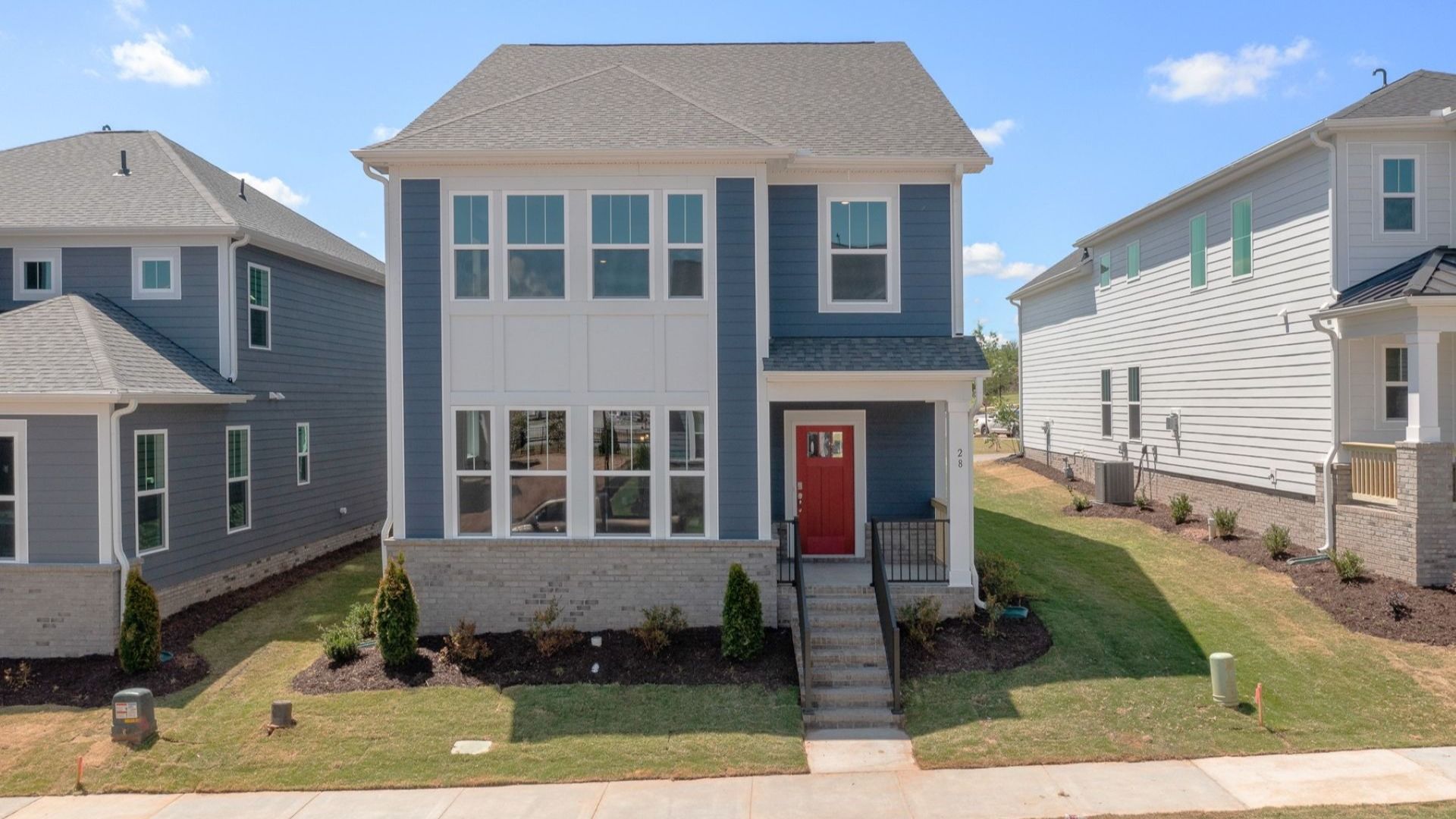 Proven curb appeal of the Archdale floorplan with elegant exterior lines and a warm, inviting presence at The Grove at Unity