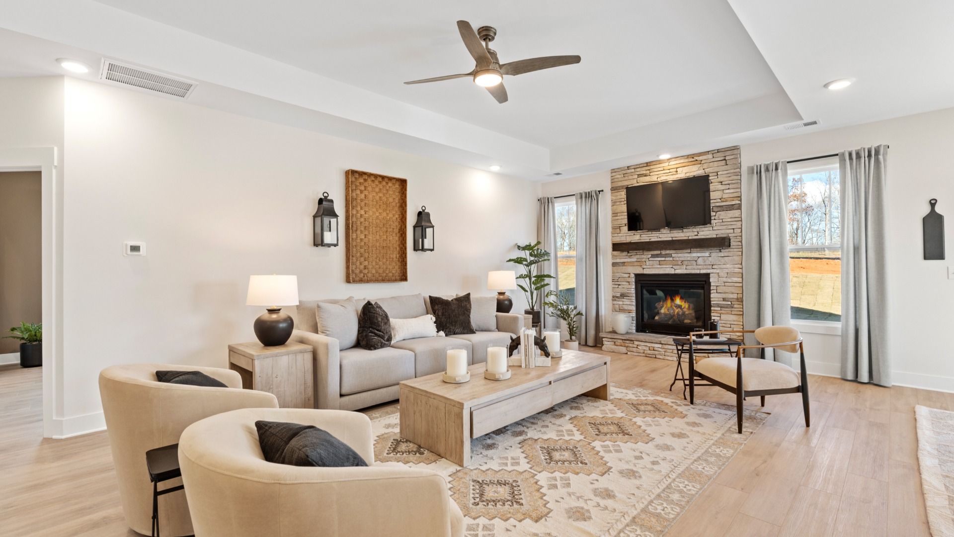 Spacious family room with rich hardwood flooring and elegant trim work in a reputable DRB Homes build