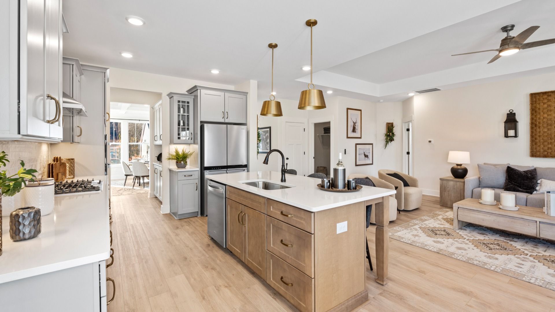 Exclusive kitchen design with large island, pendant lights, and tasteful finishes throughout at the Foxbank community