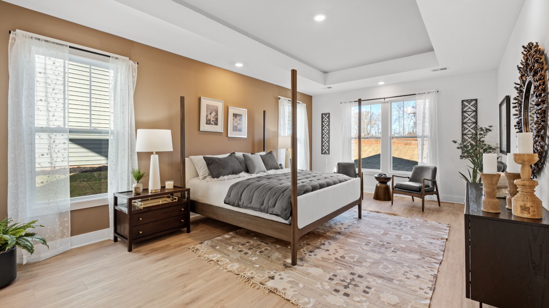 First-class hardwood floors and tasteful finishes elevate the private retreat of this exceptional primary suite