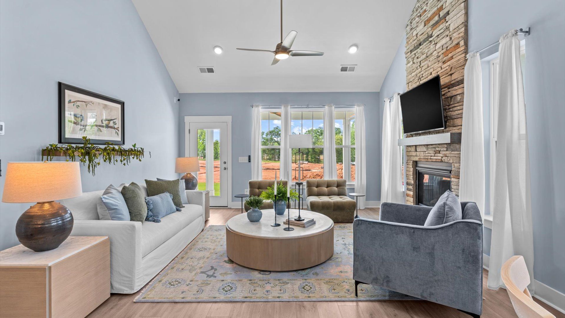 Highly skilled craftsmanship and modern elegance meet in this family room with soaring ceilings at Robert's Farm