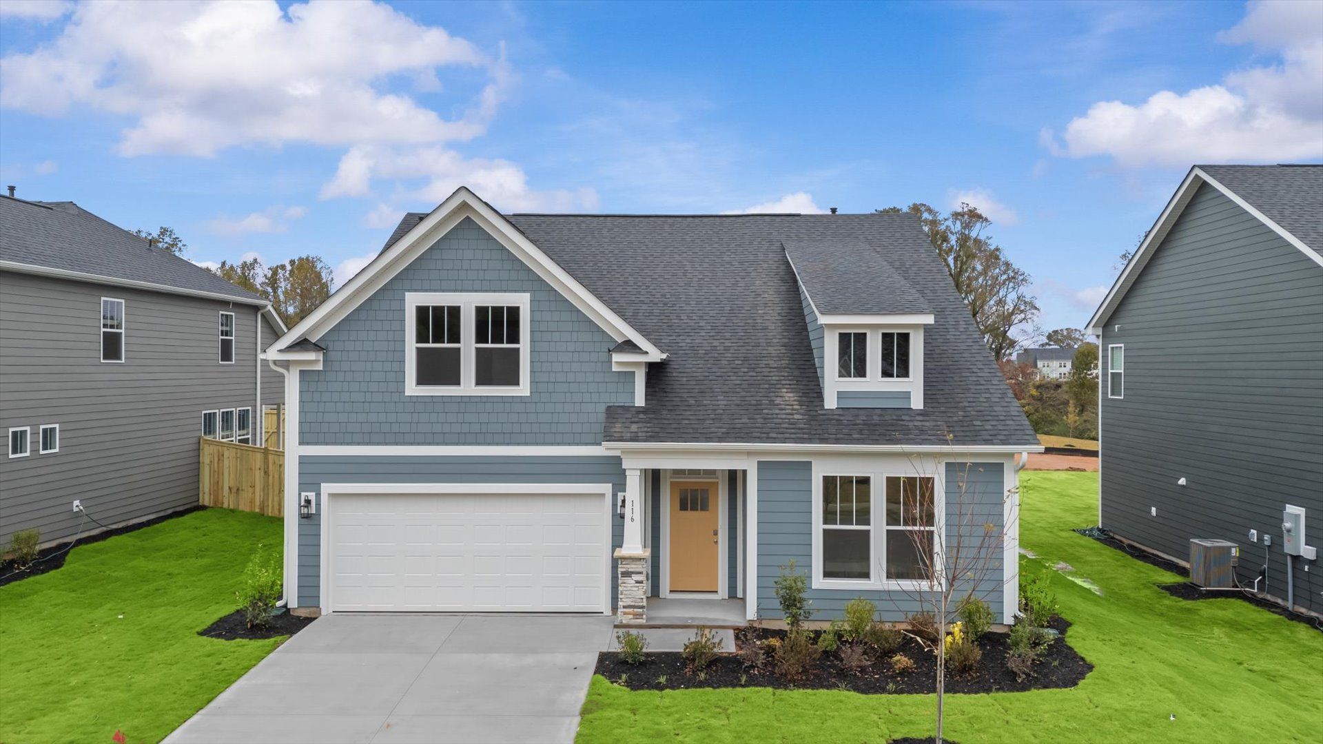 Notable curb appeal and elegant interiors of the Cooper 3 floorplan in this reputable community near Greenville’s core