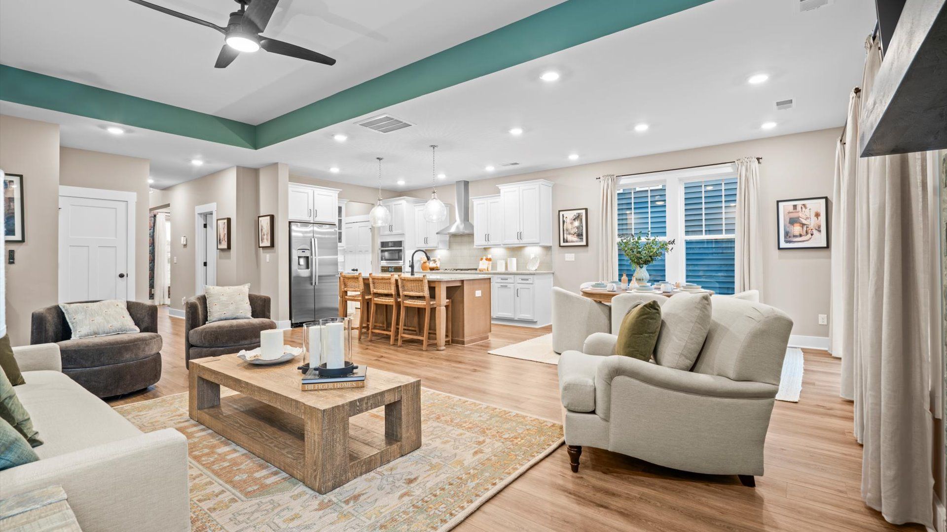 Eye-catching family room of the Middleton design with elegant millwork and seamless access to dining and kitchen