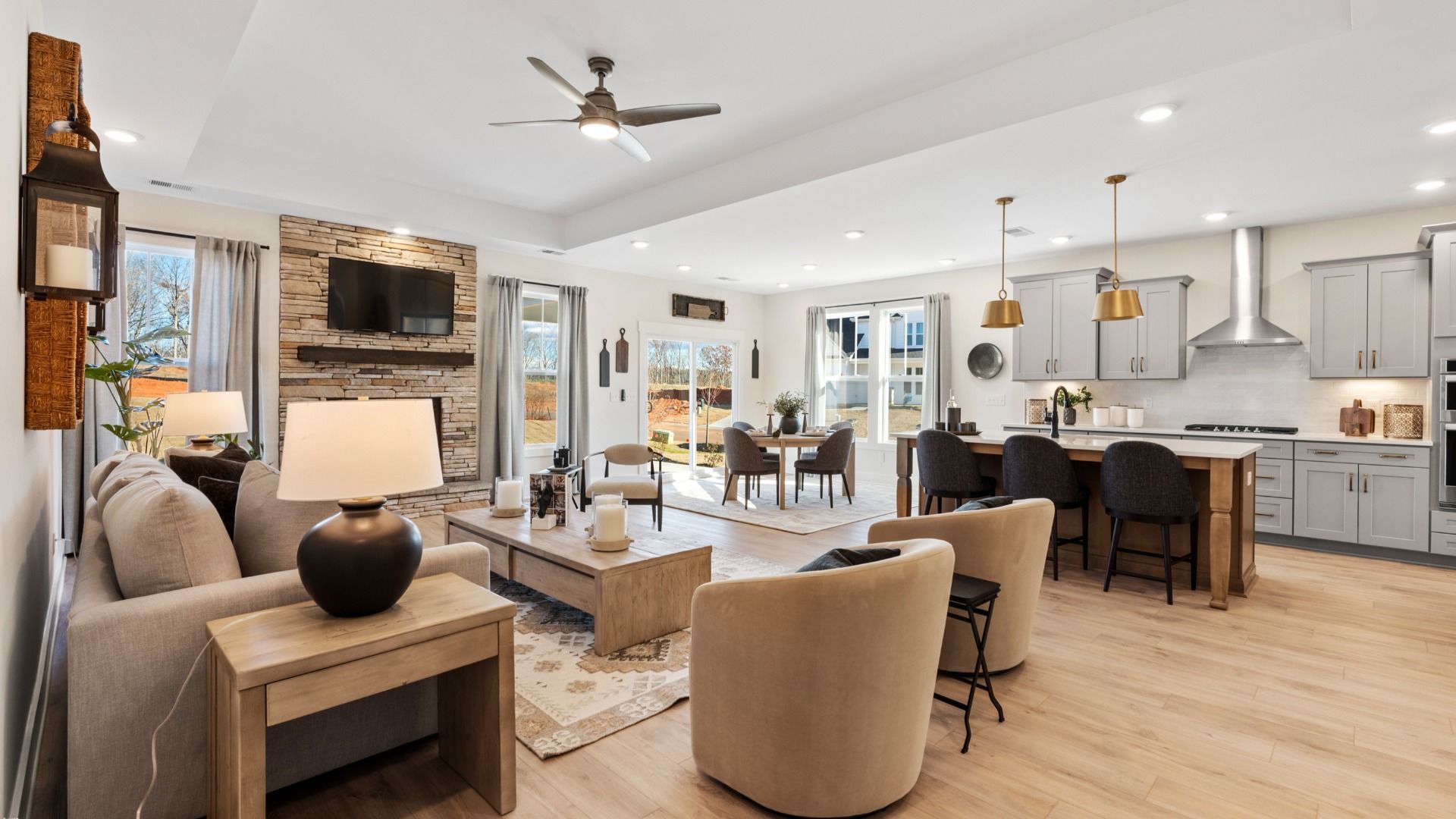 Superior design shines in this open-concept family room with timeless finishes and a modern edge at Robert's Farm