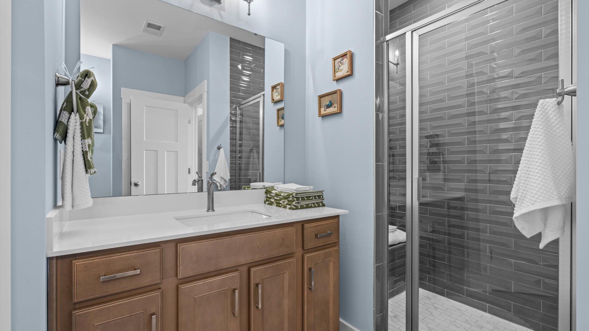 Spacious and modern primary bathroom with walk-in shower and first-class double vanity setup located in Greenville, SC