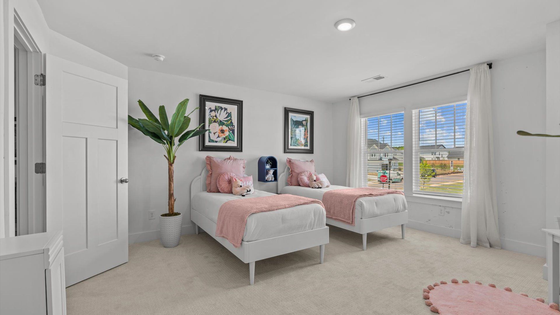 Highly functional bedroom with large windows, carpeted flooring, and tasteful finishes throughout near Downtown Greenville