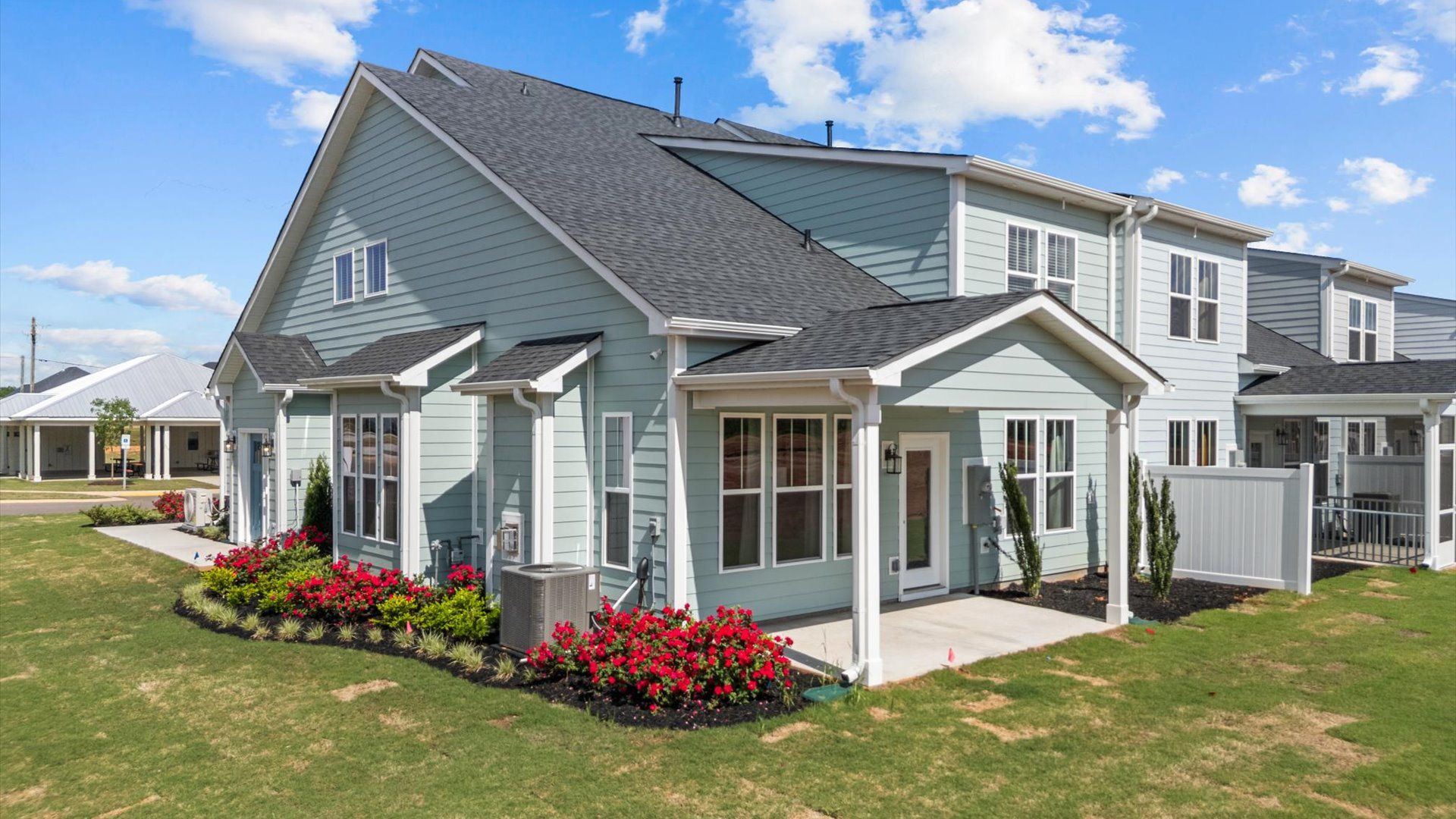 Elegant exterior with a rear covered porch—perfect for relaxing or entertaining outdoors at the new Robert's Farm community