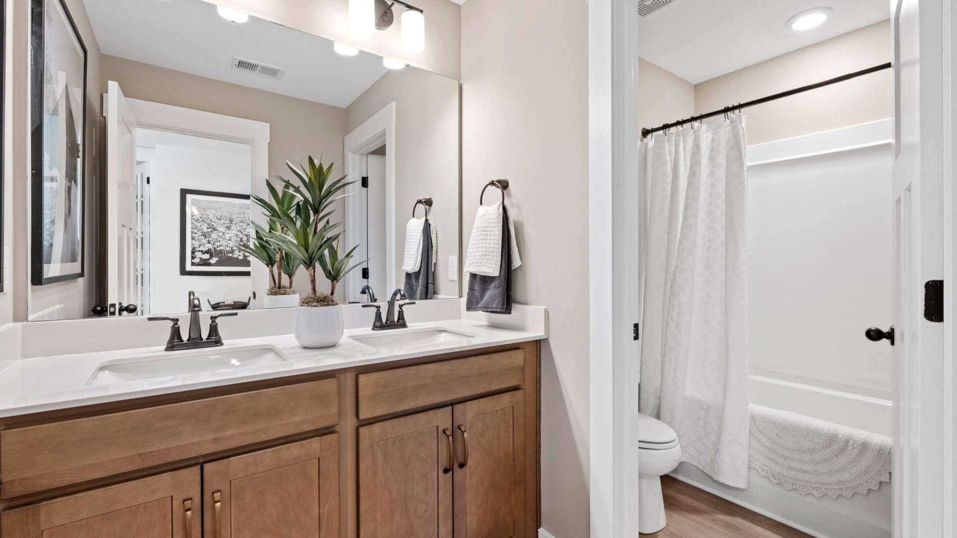 Accomplished Middleton bathroom design with sleek tile, high-quality cabinetry, and refined hardware at Robert's Farm