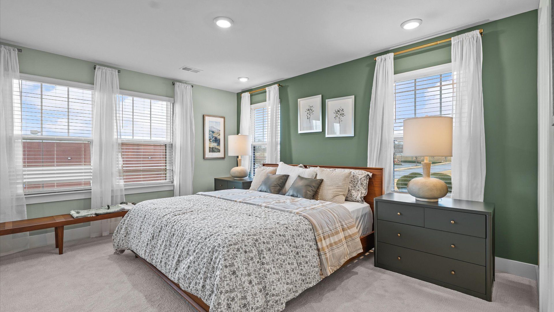 Serene and stylish primary bedroom featuring hardwood flooring and a thoughtful, modern layout near Downtown Simpsonville