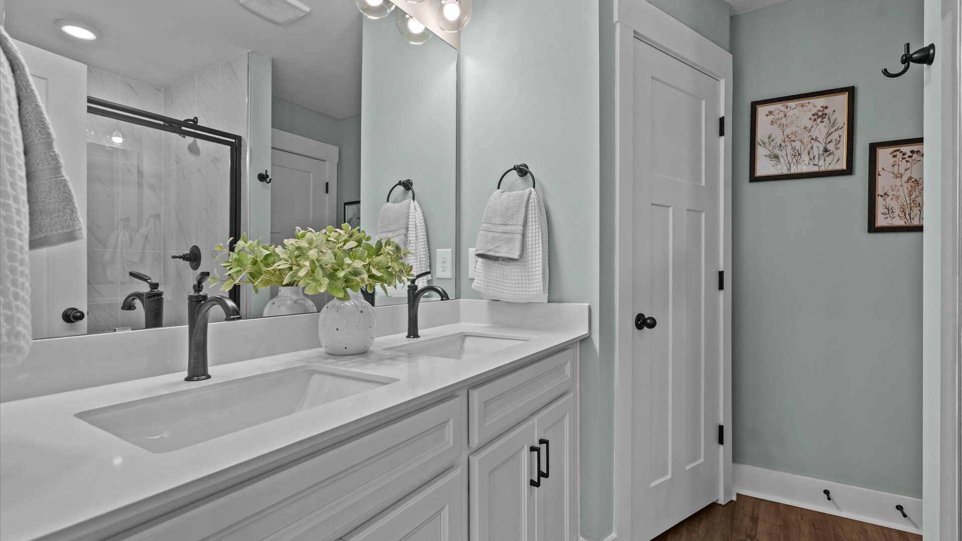 Exceptional en-suite with dual vanity and glass-enclosed walk-in shower for superior everyday comfort at Anna's Pointe