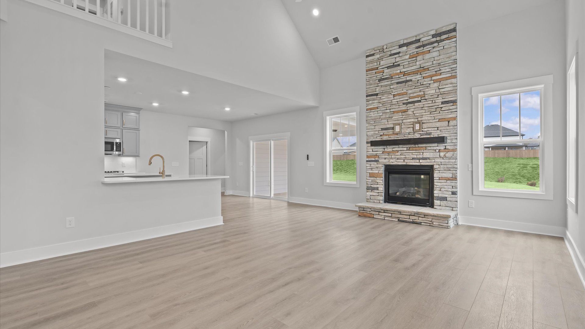 Eye-catching family room with elegant millwork and seamless access to dining and kitchen near Downtown Anderson