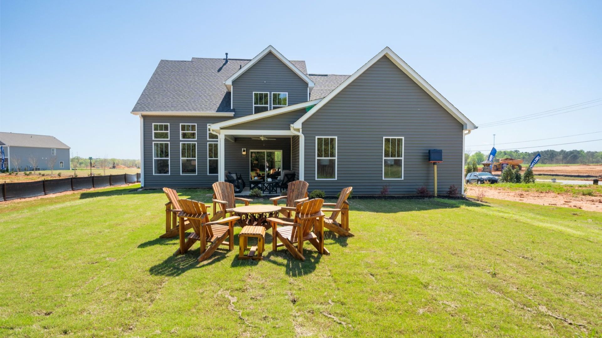 Exceptional outdoor living begins with a covered back porch in this thoughtfully designed home