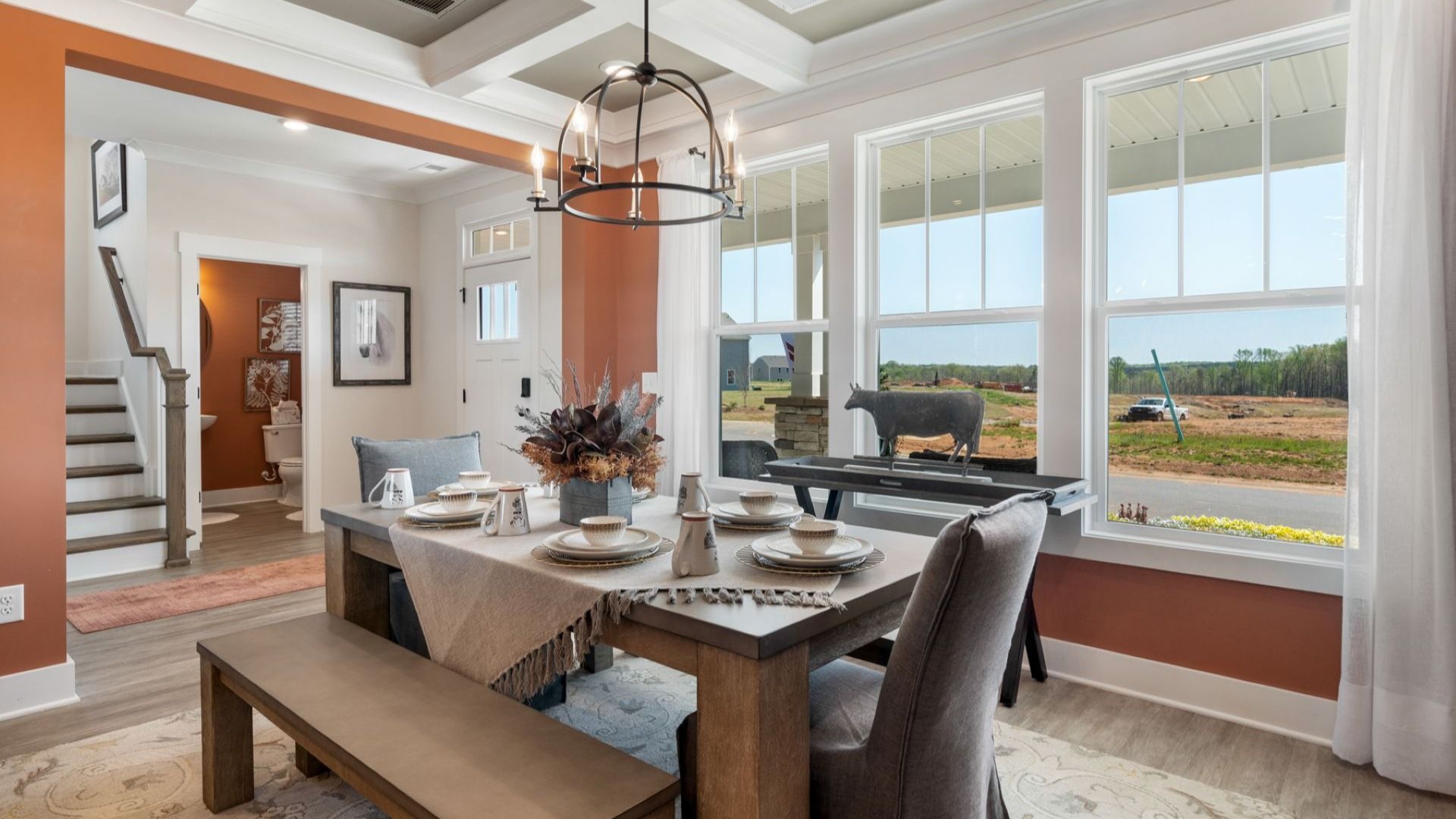 Desirable dining room with coffered ceiling and modern elegance in an established community in Seneca, SC