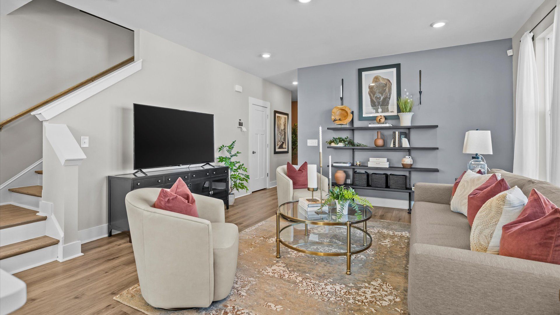 Cozy, inviting family room with hardwood flooring in two story townhome at Saluda Crossing by DRB Homes in Piedmont, SC